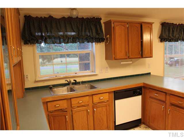 1553 Lettuce Hall Road Spring Hope, NC 27882 - Photo 5 of 16 a kitchen with a sink and cabinets