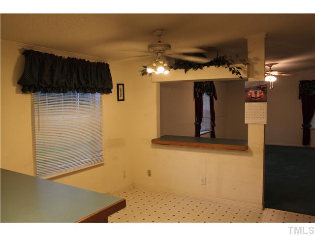 1553 Lettuce Hall Road Spring Hope, NC 27882 - Photo 7 of 16 a view of a living room with a tv