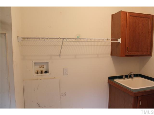1553 Lettuce Hall Road Spring Hope, NC 27882 - Photo 8 of 16 a bathroom with a sink and mirror