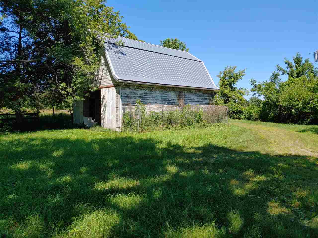 4911 East Fawver Road Ridott, IL 61067 - Photo 3 of 24 a aerial view of a house