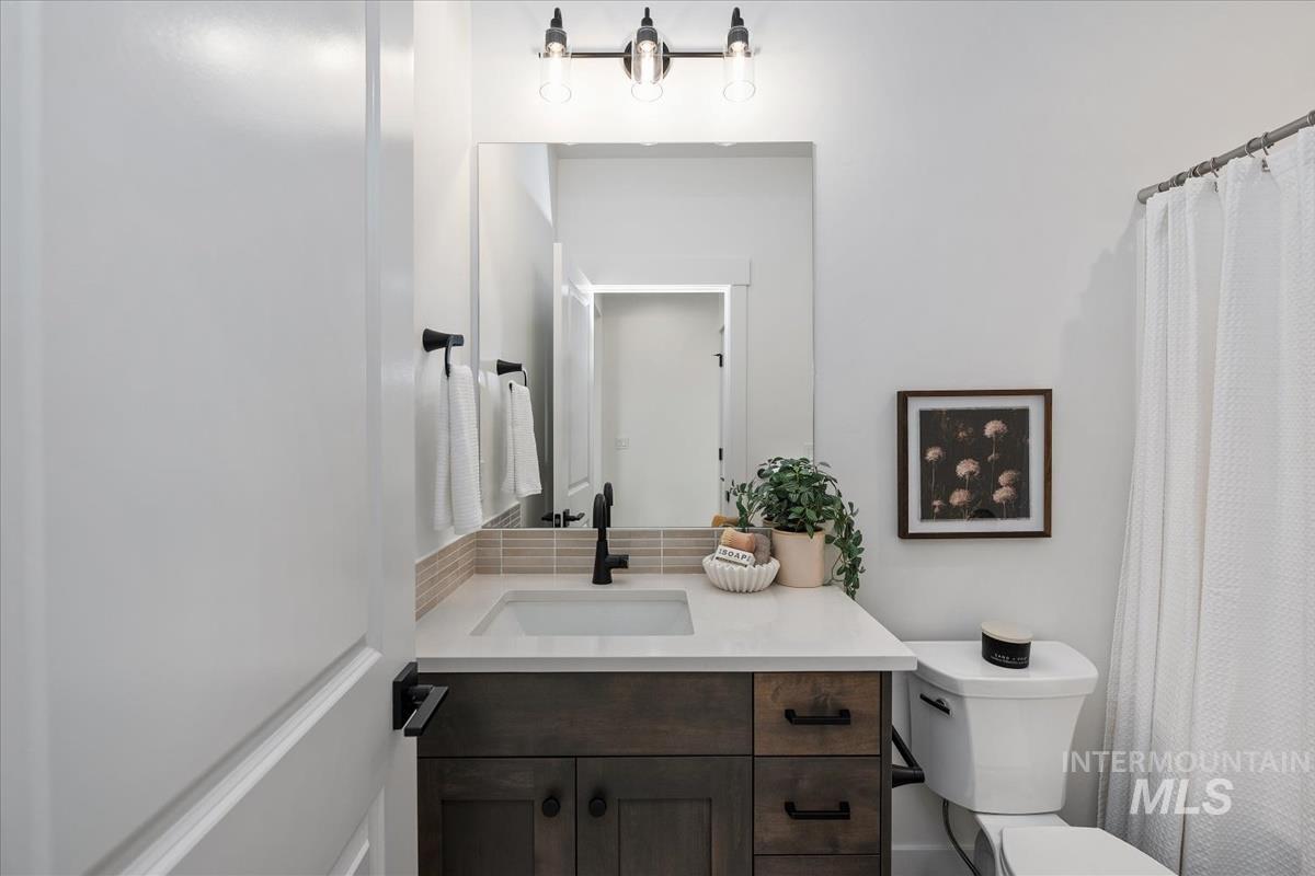 749 South Calhoun Lane Star, ID 83669 - Photo 28 of 34 Bathroom featuring vanity and curtained shower