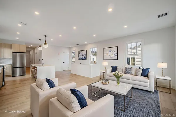 a living room with furniture and a table