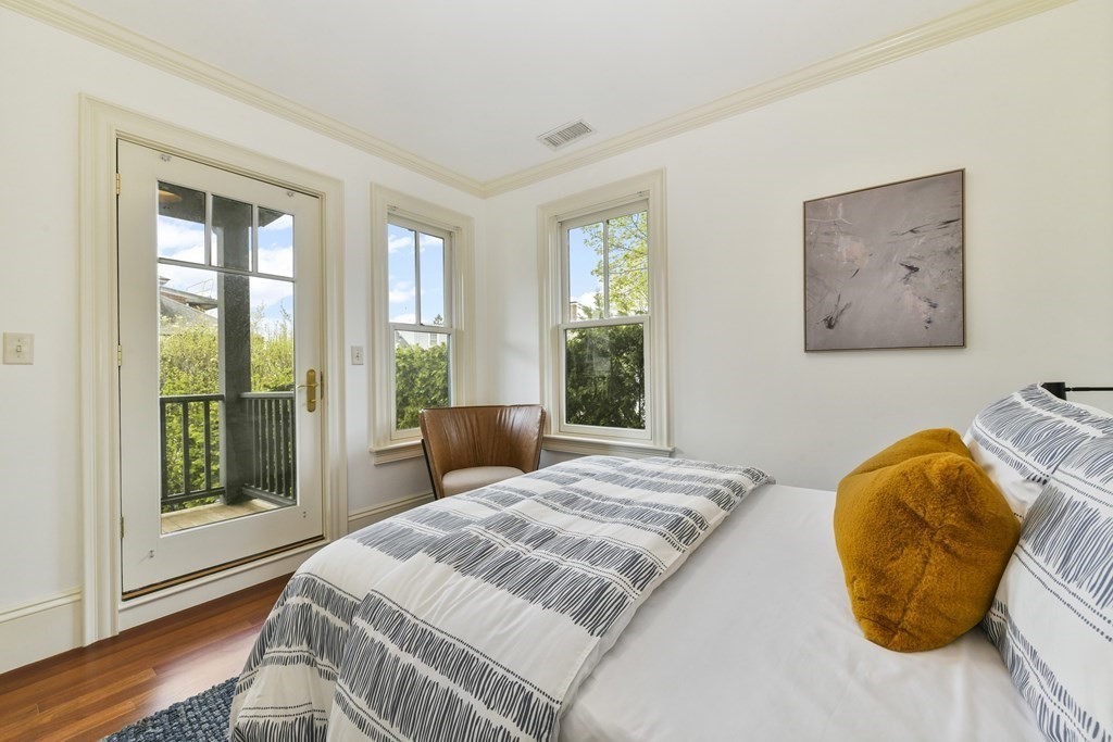 35 Blakeslee Street Cambridge, MA 02138 - Photo 21 of 31 a bed sitting in a bedroom next to a window