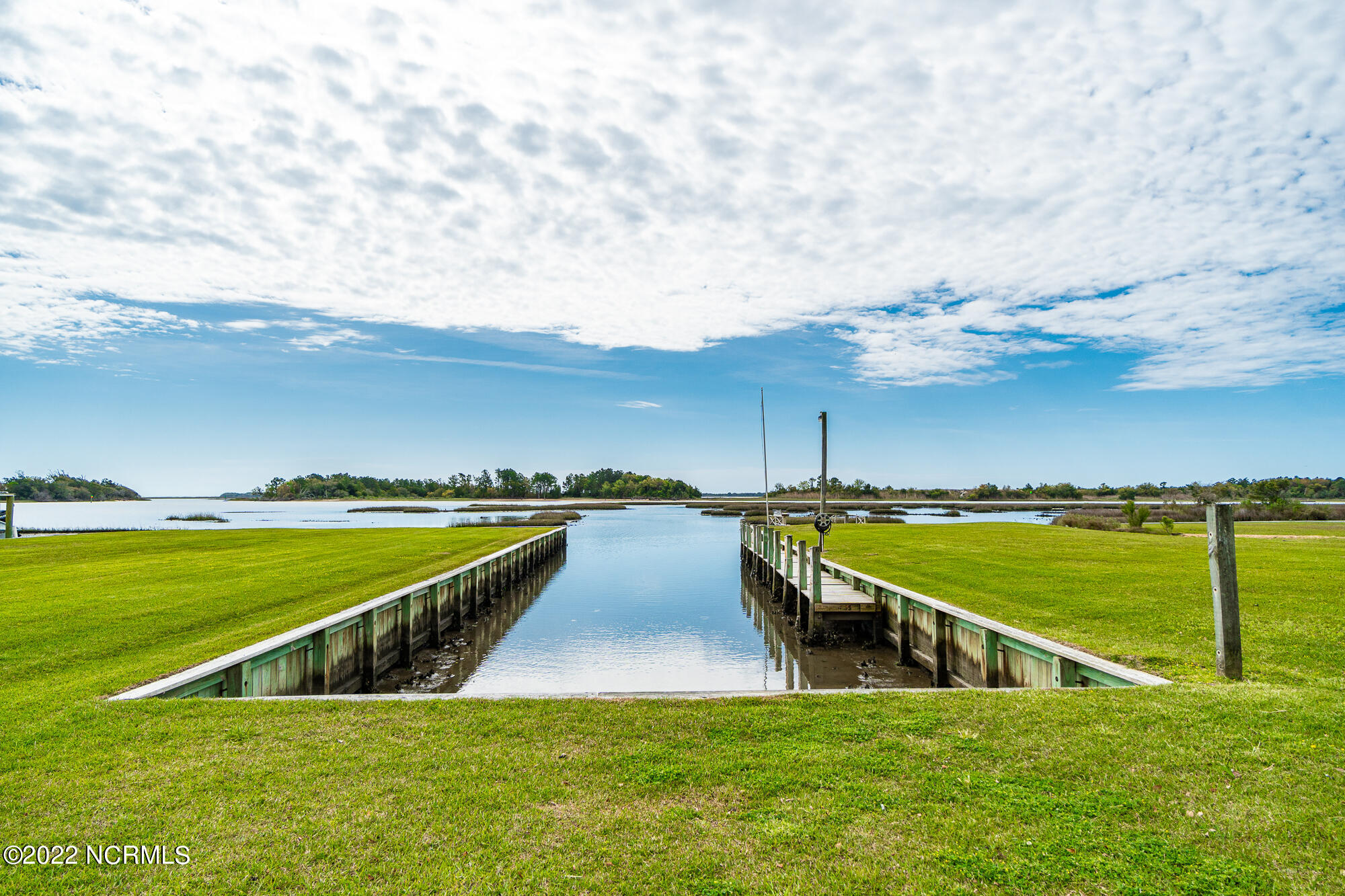 216 Peninsula Manor Road Hubert, NC 28539 - Photo 6 of 54 Private Marina / Boat slip 25' Wide x 120' Long and 32' wide at entrance