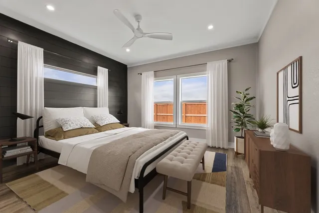 a bedroom with a large bed and a large window