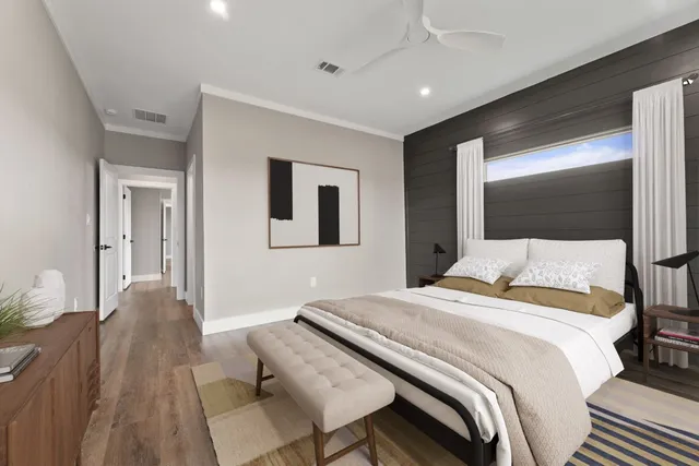 a bedroom with a bed and a mirror