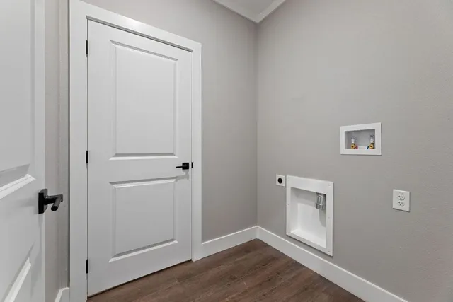 an empty room with wooden floor