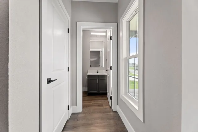 a view of a hallway with a hallway and wooden floor
