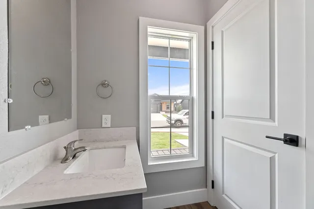 a bathroom with a sink and a mirror