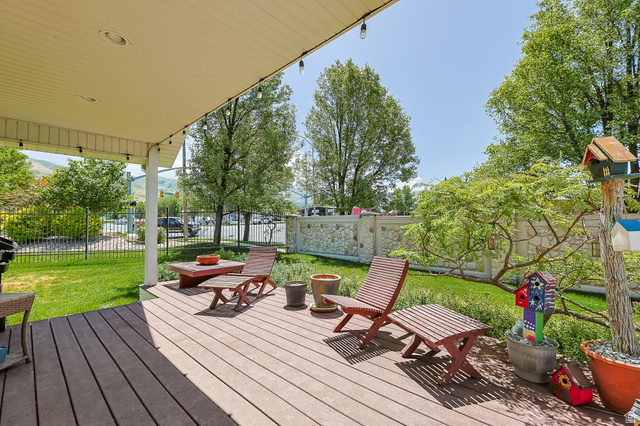 31 Village Square Road Centerville, UT 84014 - Photo 27 of 29 Spacious covered deck featuring composite wood-finish decking