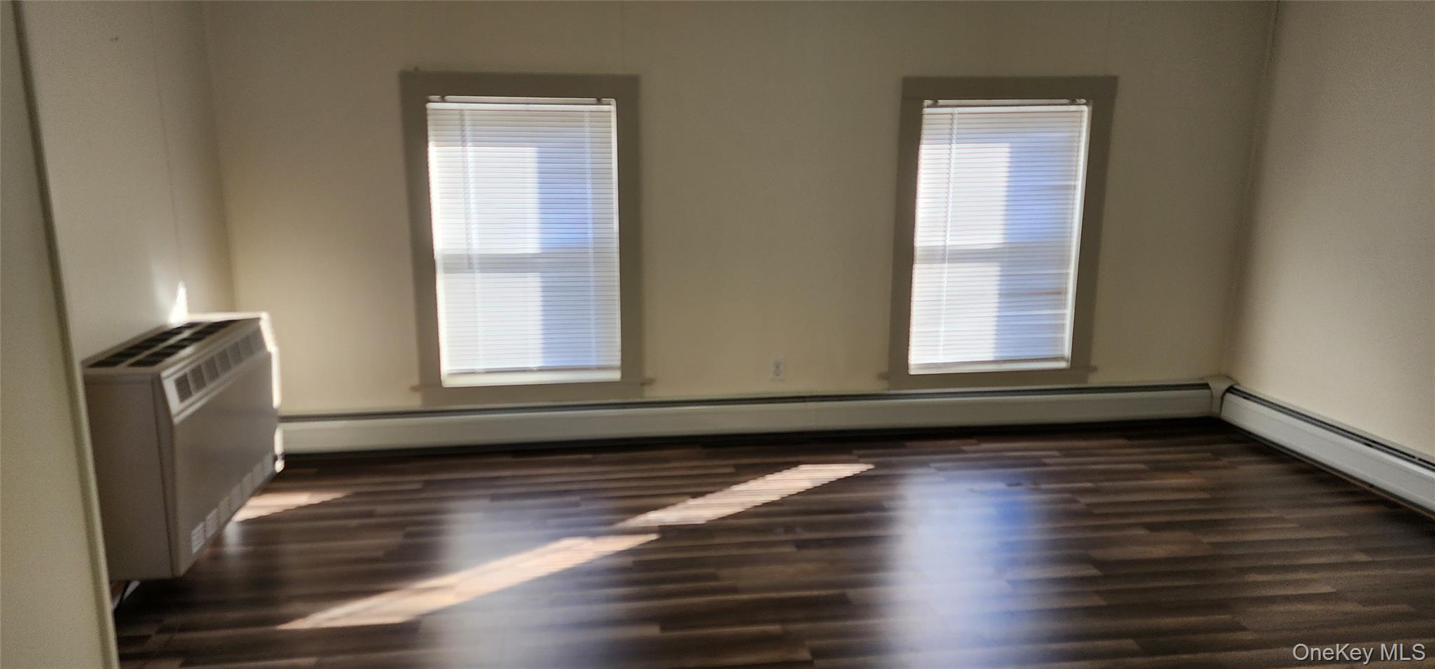 6 Lower Brook Road Sparrowbush, NY 12780 - Photo 12 of 18 a view of an empty room with wooden floor and a window