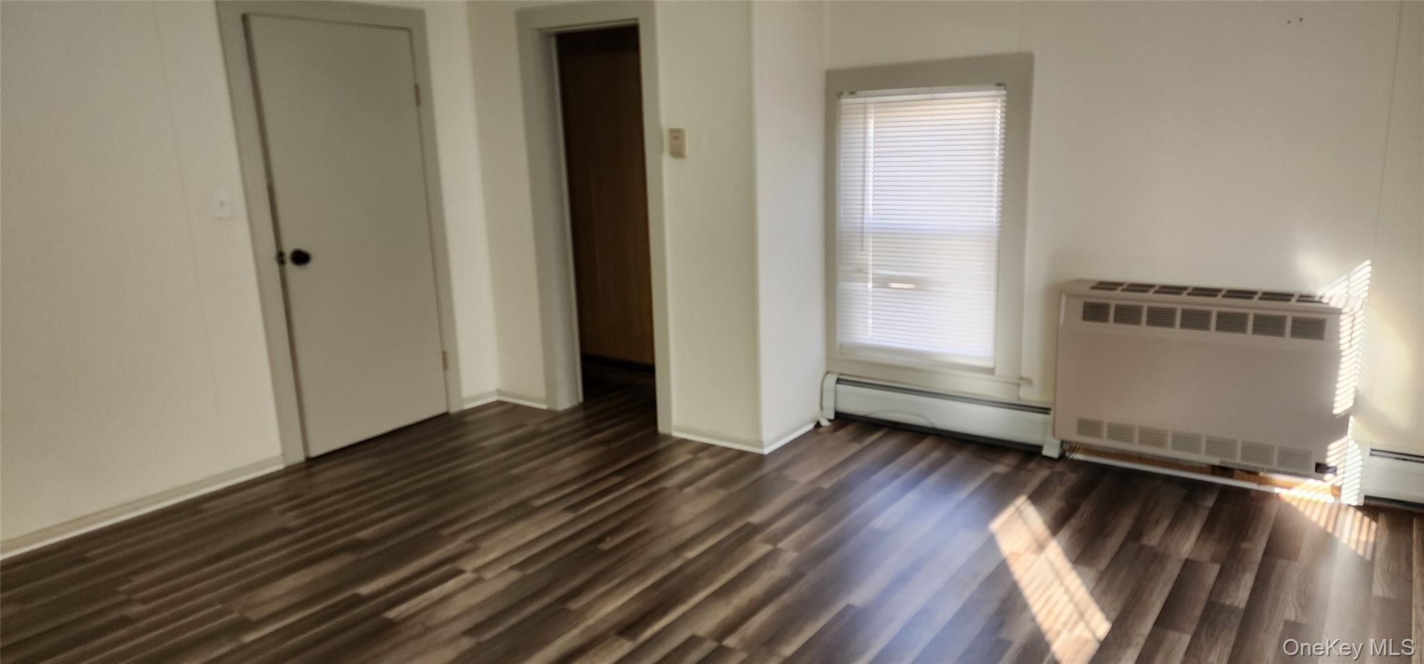 6 Lower Brook Road Sparrowbush, NY 12780 - Photo 13 of 18 an empty room with wooden floor and windows