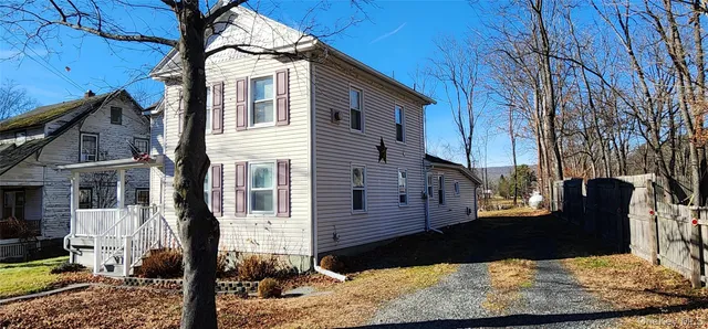 a view of a house with a yard