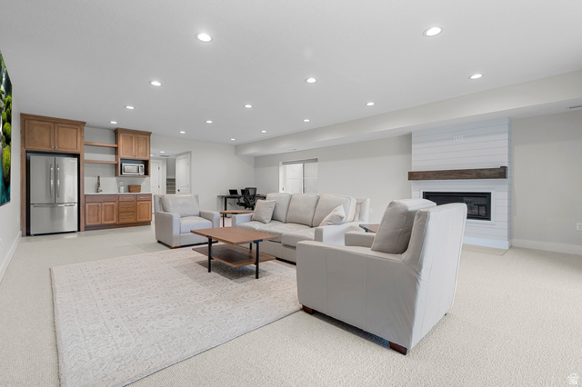 250 South Main Street, Unit 24 Alpine, UT 84004 - Photo 33 of 50 Living room featuring recessed lighting, light colored carpet, and a fireplace