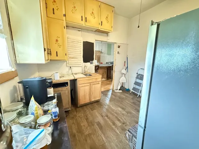 a bathroom with a sink mirror and toilet