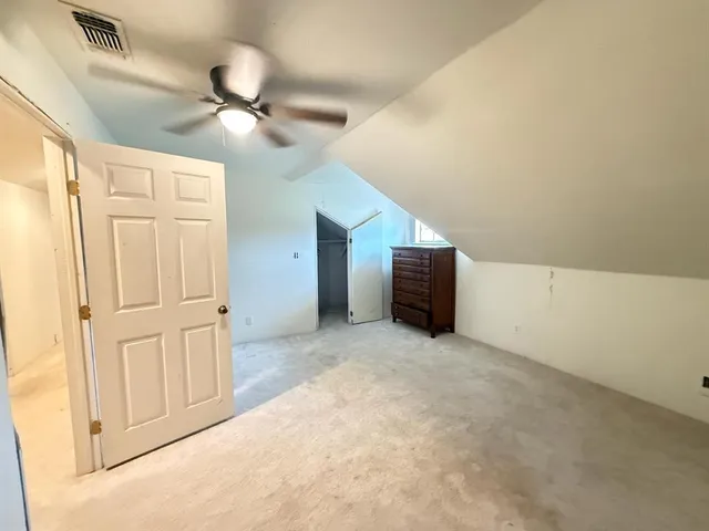 a bathroom with a sink mirror and toilet