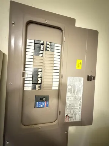 a view of a wooden door and a window