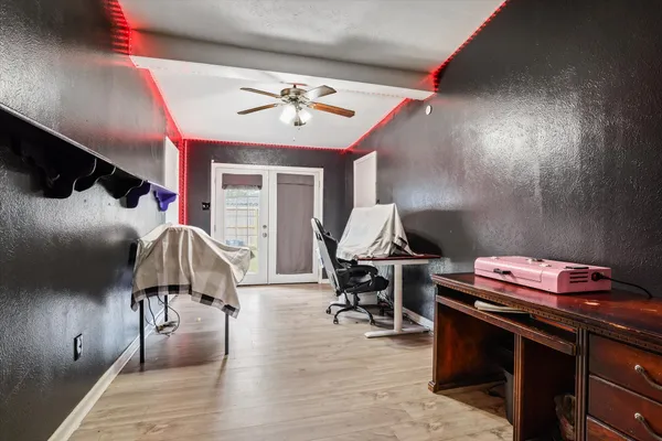 a bedroom with a bed and a chandelier
