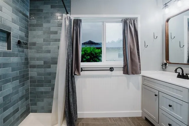 a bathroom with a sink and a mirror