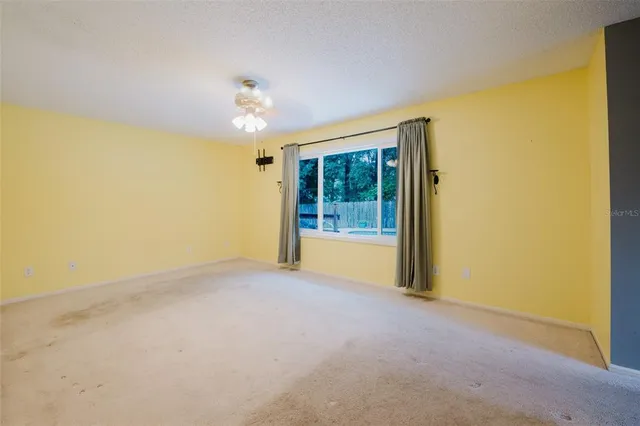 a spacious bathroom with a sink mirror and vanity