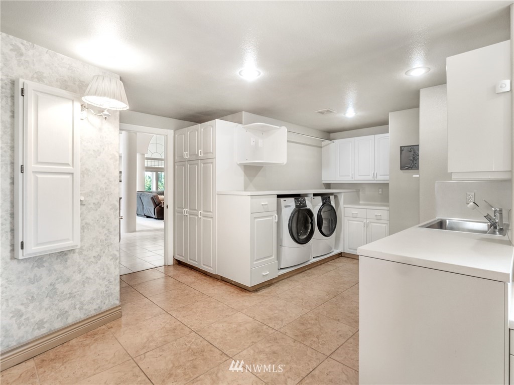 2599 Seminary Hill Road Centralia, WA 98531 - Photo 13 of 29 a kitchen with a refrigerator sink and cabinets