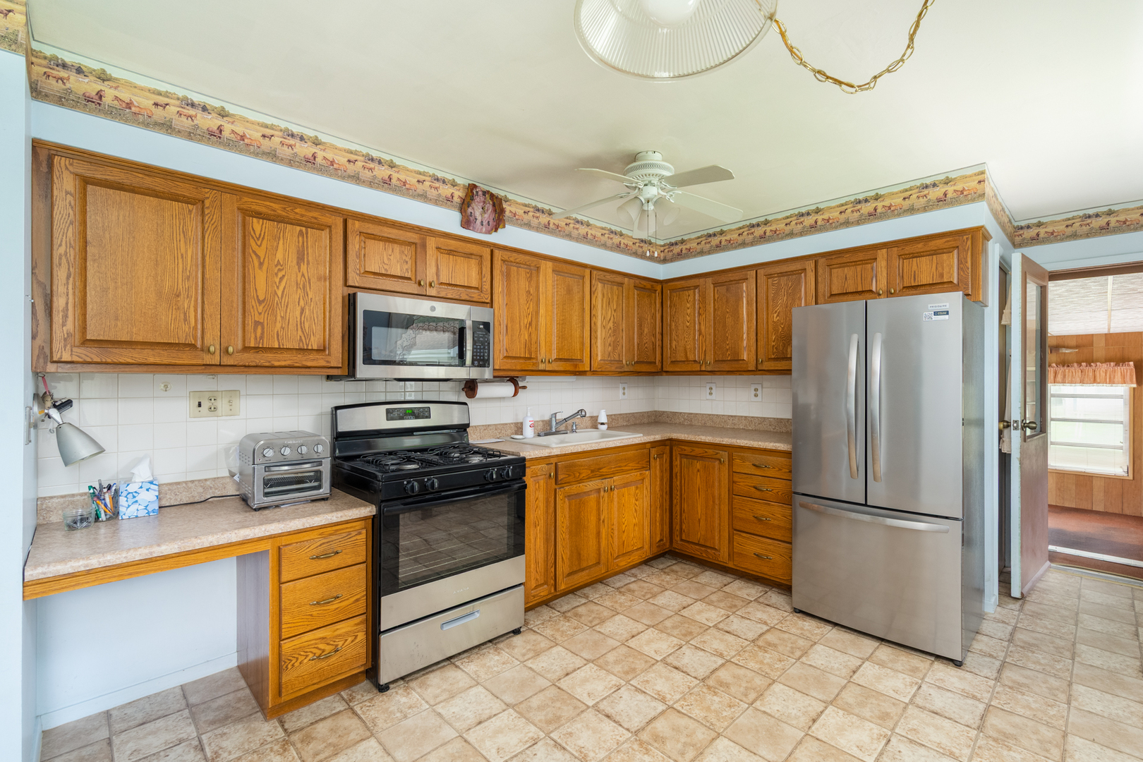 698 North 2853rd Road LaSalle, IL 61301 - Photo 13 of 39 a kitchen with stainless steel appliances granite countertop a refrigerator sink and cabinets