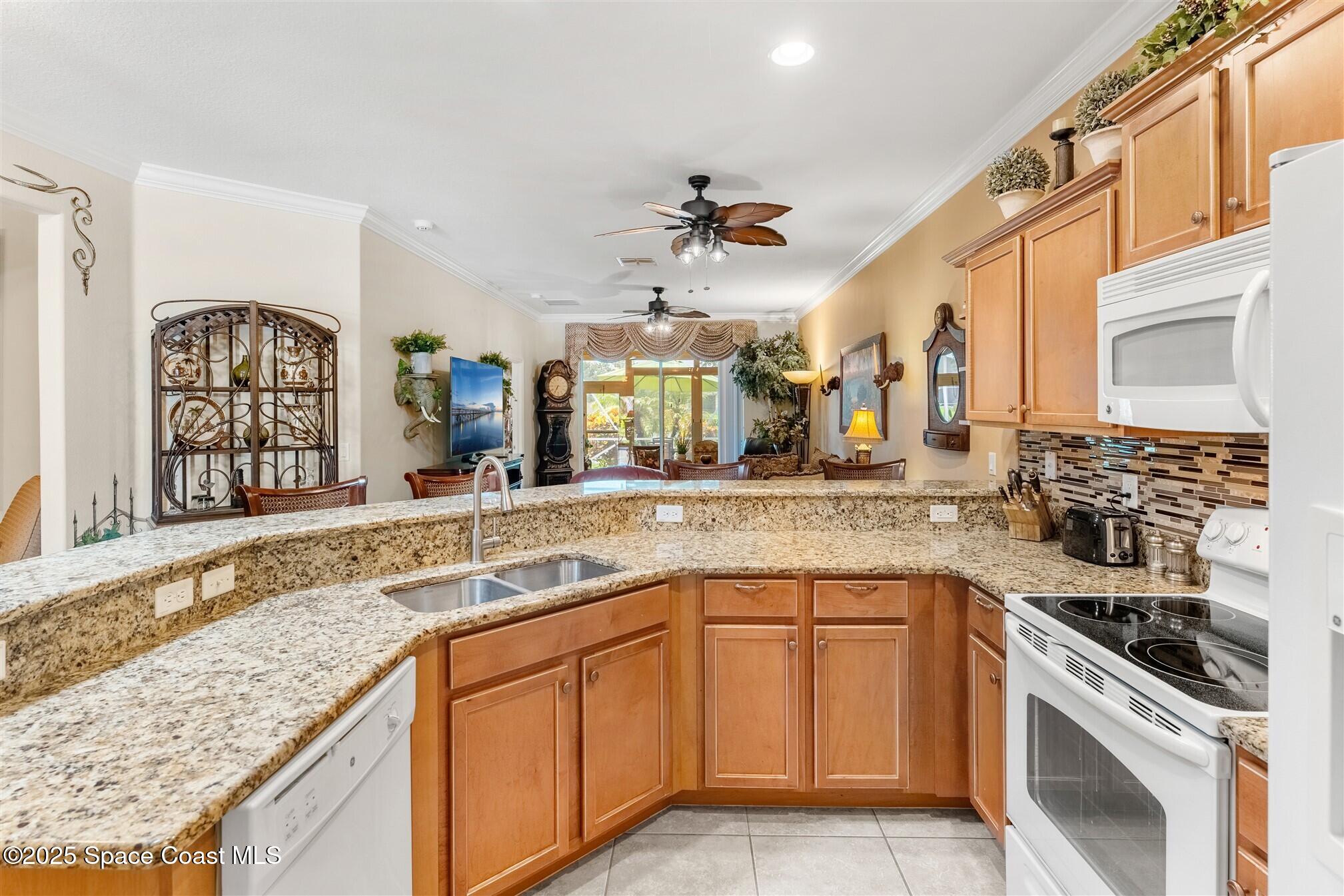 3541 Funston Circle Melbourne, FL 32940 - Photo 11 of 79 Kitchen Overlooks Great Room