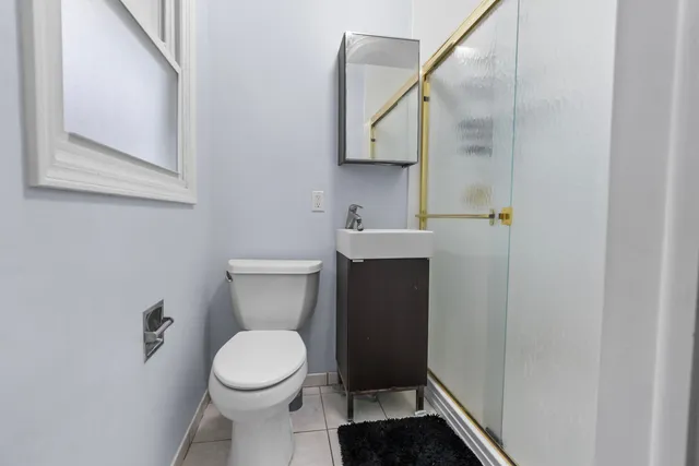a bathroom with a toilet and a sink