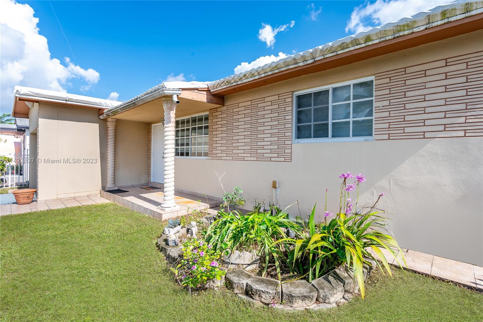 79 West 37th Street Hialeah, FL 33012 - Photo 11 of 28 a front view of a house with a yard