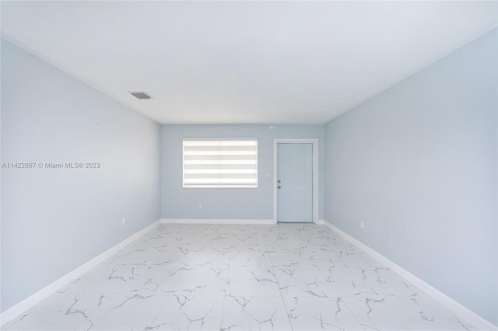 79 West 37th Street Hialeah, FL 33012 - Photo 18 of 28 a view of an empty room with a window