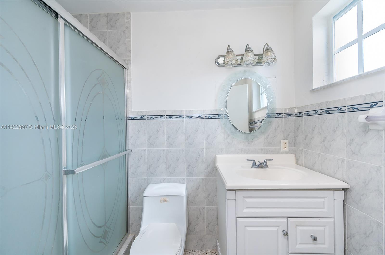 79 West 37th Street Hialeah, FL 33012 - Photo 23 of 28 a bathroom with a sink a toilet and shower