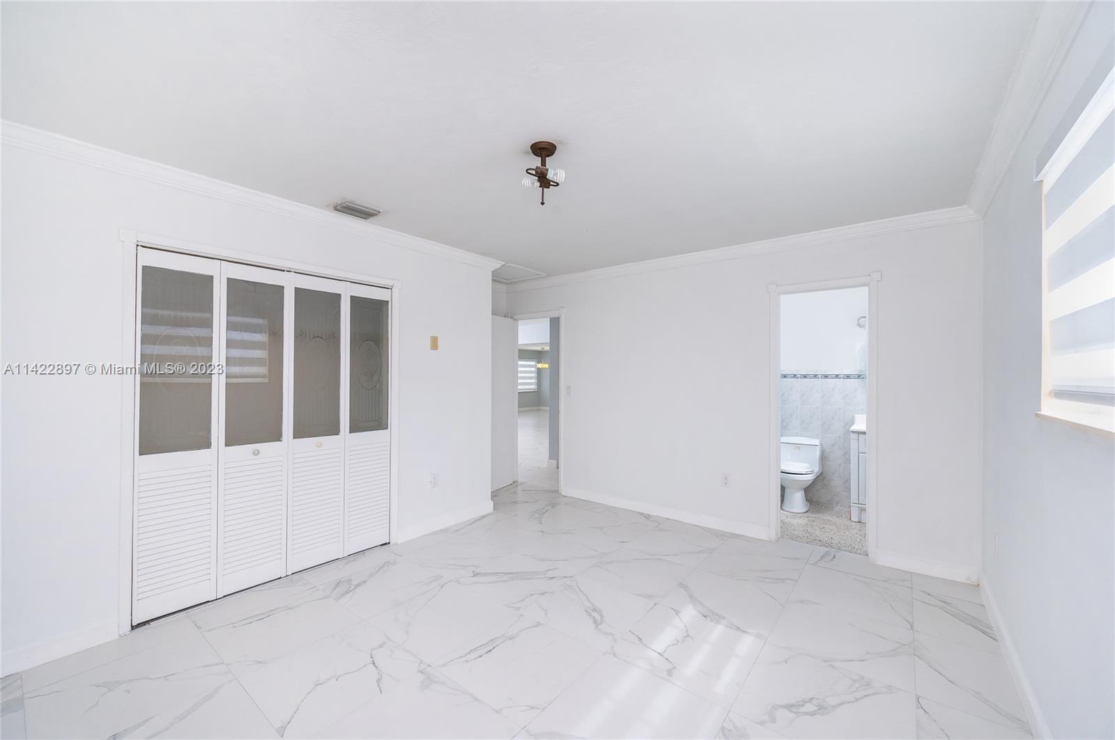 79 West 37th Street Hialeah, FL 33012 - Photo 24 of 28 a view of an empty room with a window