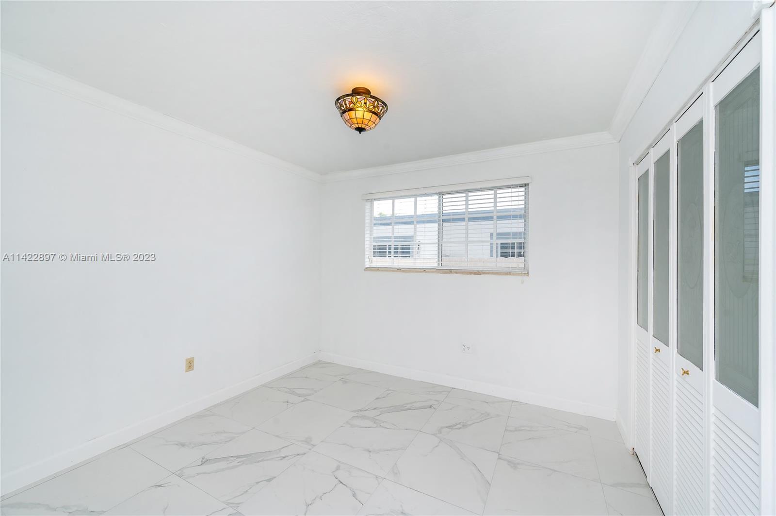 79 West 37th Street Hialeah, FL 33012 - Photo 26 of 28 a view of a window in a room