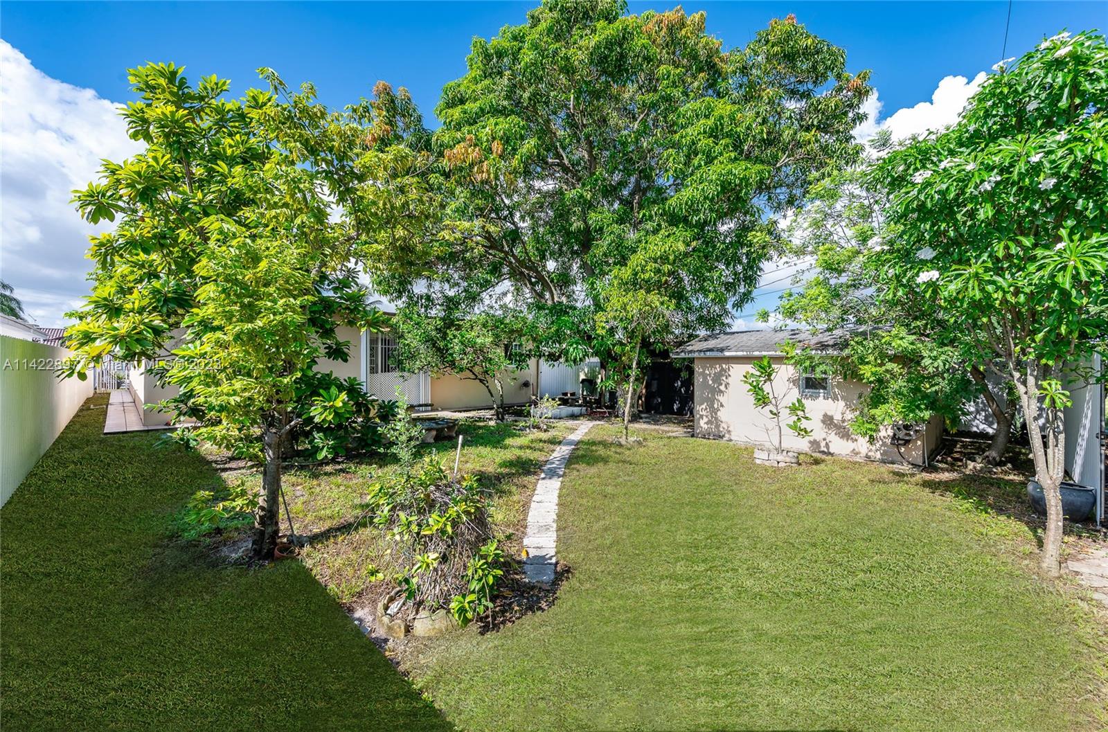 79 West 37th Street Hialeah, FL 33012 - Photo 10 of 28 a view of a house with a yard