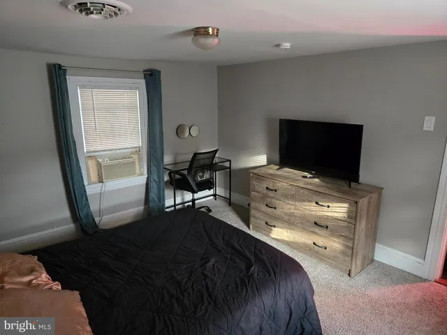 a bathroom with a granite countertop sink