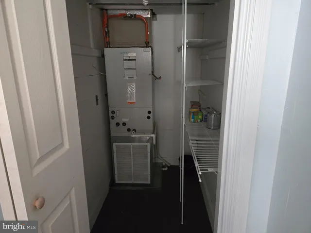 a bathroom with a sink a window and a shower