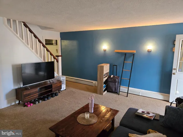 a room with furniture and a flat screen tv