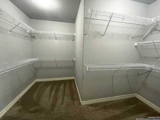 a view of a room with racks on the wall