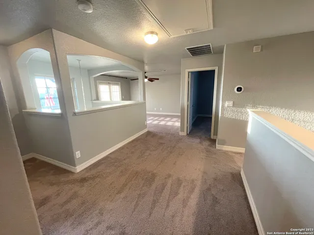 a view of livingroom with hardwood floor and hallway