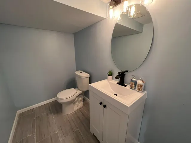 a view of an empty room with a kitchen