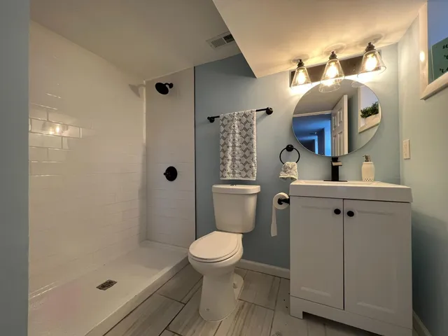 a view of a room with wooden walls