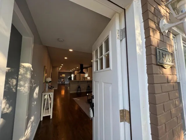 a view of a hallway with windows