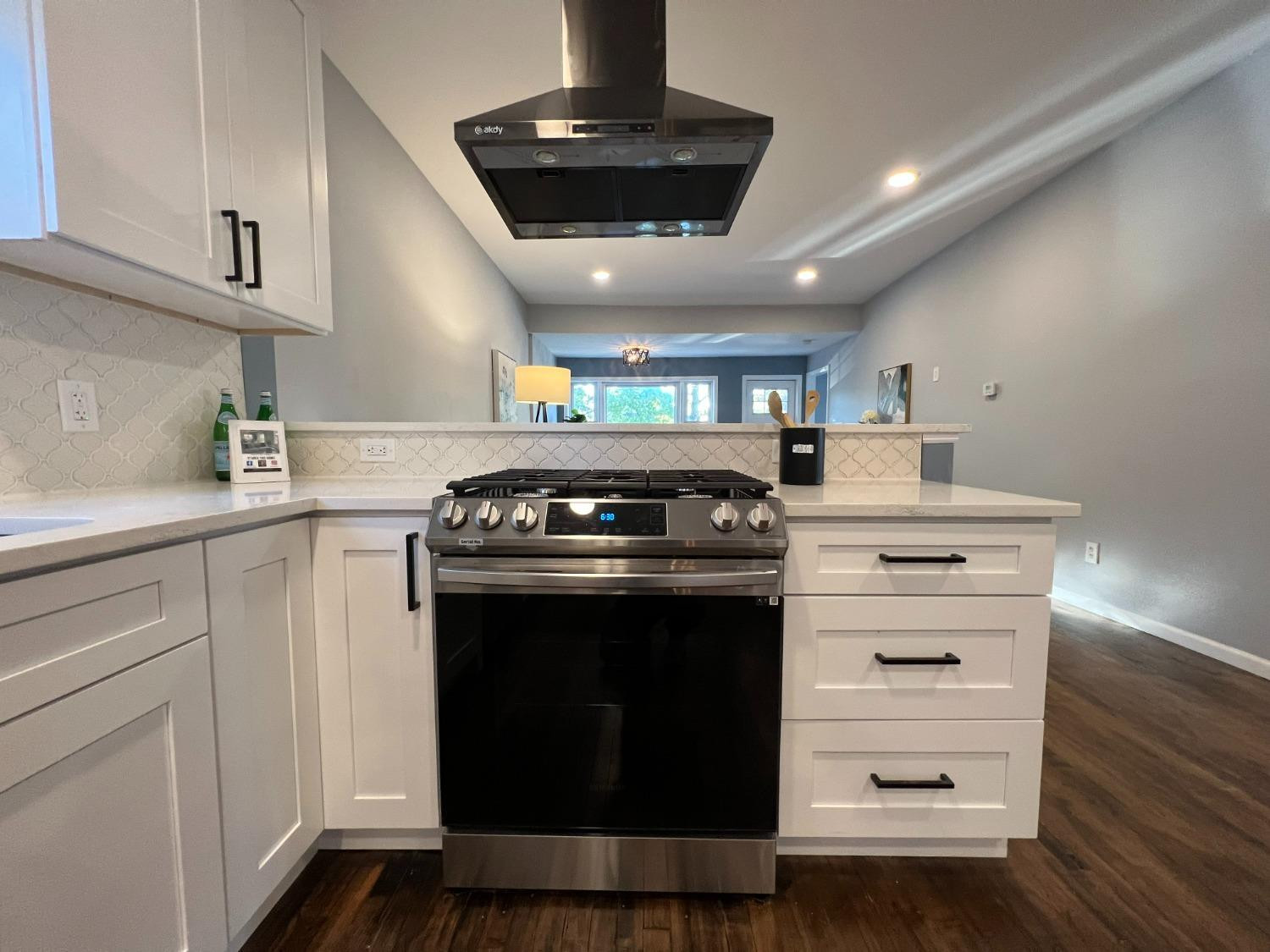 1509 Myrtle Avenue Whiting, IN 46394 - Photo 8 of 26 a kitchen with stainless steel appliances granite countertop a stove and a sink with cabinets