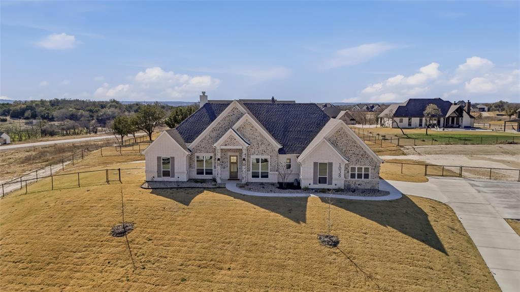 1038 Deer Island Azle, TX 76020 - Photo 1 of 32 a view of a house with swimming pool and mountains in the background