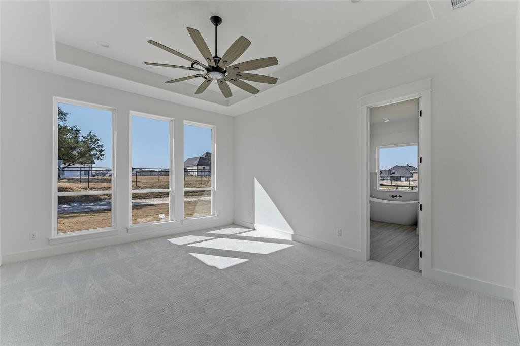 1038 Deer Island Azle, TX 76020 - Photo 17 of 32 a view of a livingroom with a ceiling fan and window