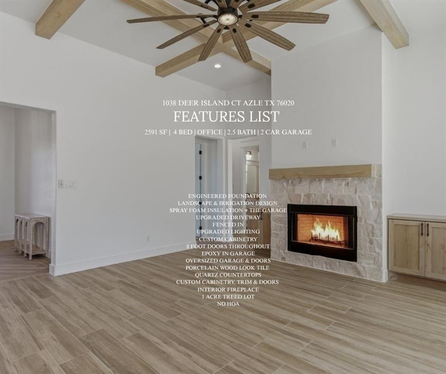 1038 Deer Island Azle, TX 76020 - Photo 2 of 32 a view of an empty room with a fireplace and a fan