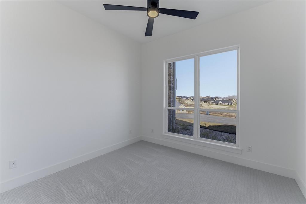 1038 Deer Island Azle, TX 76020 - Photo 21 of 32 a room with a fireplace and wooden floor