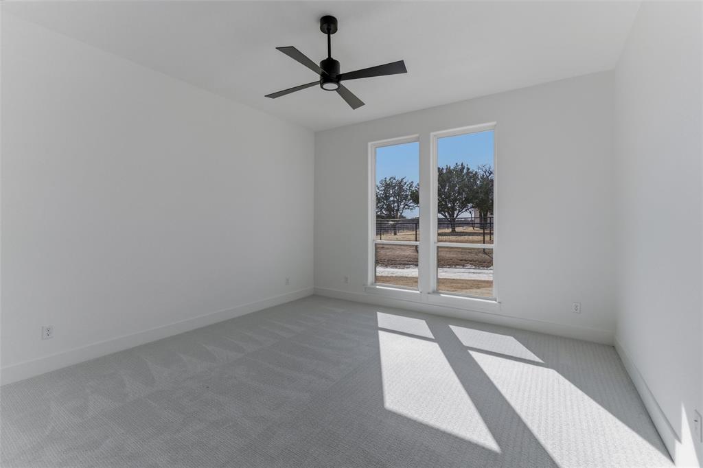 1038 Deer Island Azle, TX 76020 - Photo 23 of 32 a view of a livingroom with a ceiling fan and window