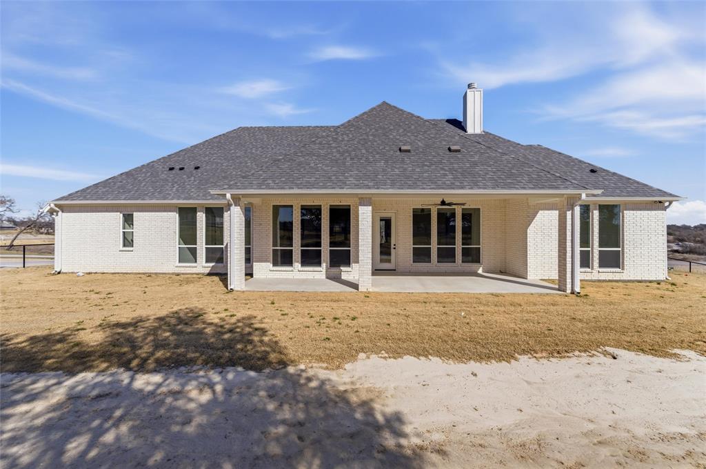 1038 Deer Island Azle, TX 76020 - Photo 28 of 32 front view of a house with a yard