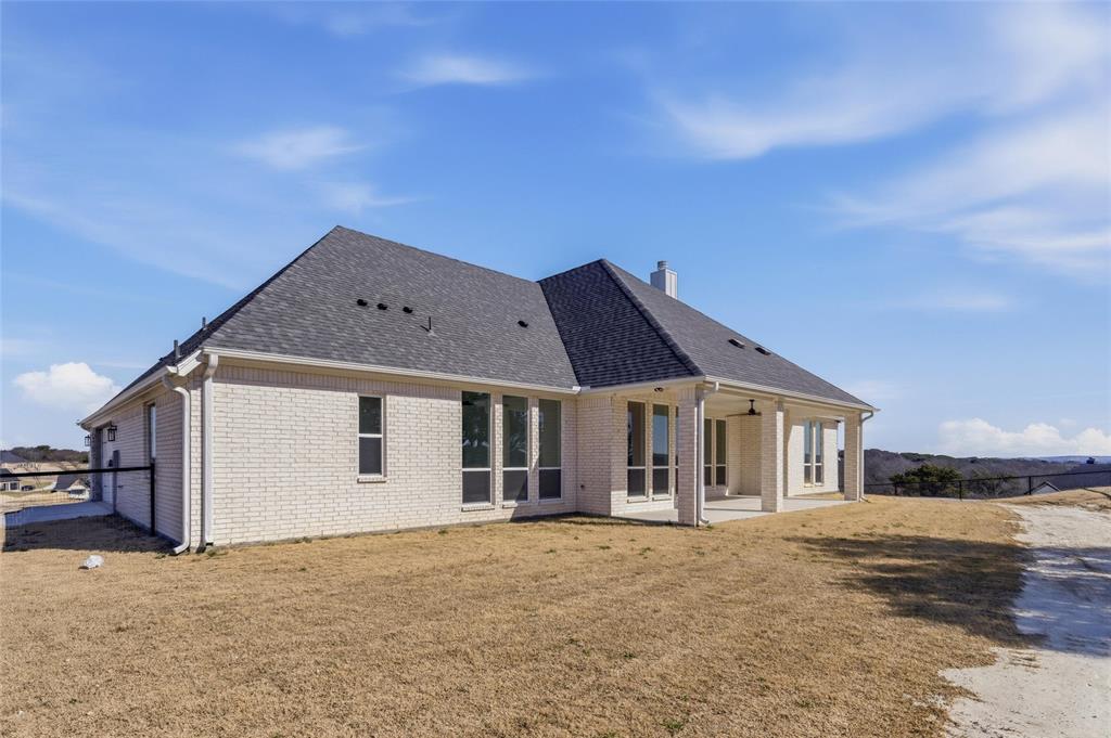 1038 Deer Island Azle, TX 76020 - Photo 29 of 32 a front view of a house with a yard